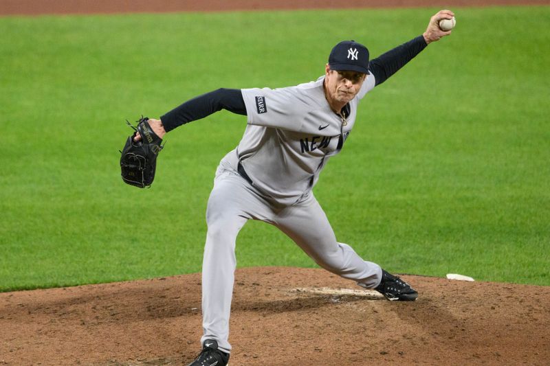 Apr 30, 2025; Baltimore, Maryland, USA; New York Yankees pitcher Tim Hill (41) throws a pitch during the fifth inning against the Baltimore Orioles at Oriole Park at Camden Yards. Mandatory Credit: Reggie Hildred-Imagn Images