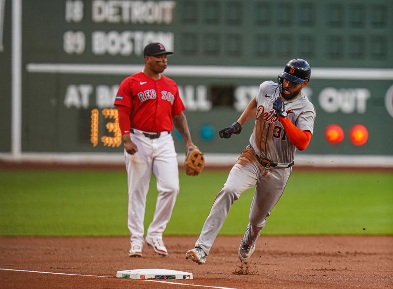 May 31, 2024; Boston, Massachusetts, USA; Detroit Tigers center fielder Riley Greene (31) sounds third base to score against the Boston Red Sox in the first inning at Fenway Park. Mandatory Credit: David Butler II-USA TODAY Sports