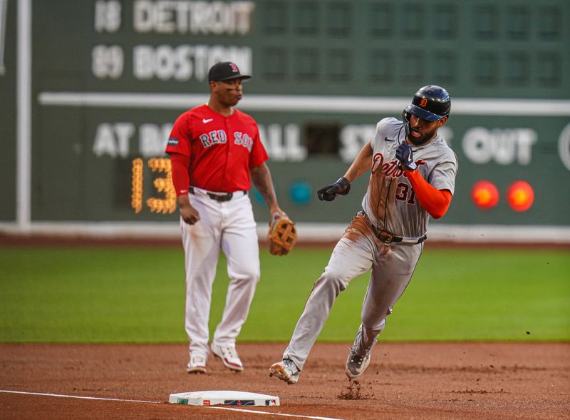 May 31, 2024; Boston, Massachusetts, USA; Detroit Tigers center fielder Riley Greene (31) sounds third base to score against the Boston Red Sox in the first inning at Fenway Park. Mandatory Credit: David Butler II-USA TODAY Sports