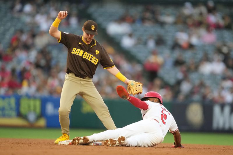 Jun 3, 2024; Anaheim, California, USA; Los Angeles Angels third baseman Luis Rengifo (2) slides into second base to beat a throw to San Diego Padres second baseman Jake Cronenworth (9) for a stolen base in the fourth inning at Angel Stadium. Mandatory Credit: Kirby Lee-USA TODAY Sports