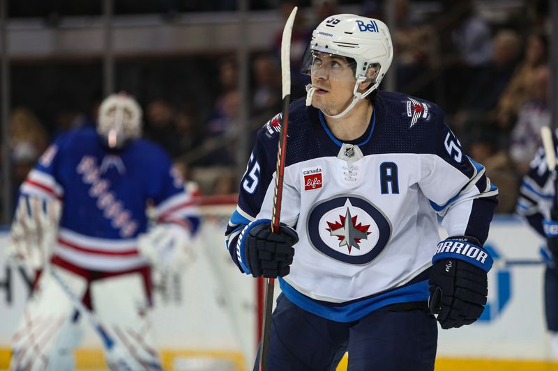 Mar 19, 2024; New York, New York, USA; Winnipeg Jets center Mark Scheifele (55) celebrates his goal against the New York Rangers during the second period at Madison Square Garden. Mandatory Credit: Danny Wild-USA TODAY Sports