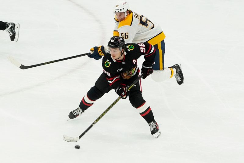 Nov 28, 2025; Chicago, Illinois, USA; Nashville Predators left wing Erik Haula (56) defends Chicago Blackhawks center Connor Bedard (98) during the third period at United Center. Mandatory Credit: David Banks-Imagn Images