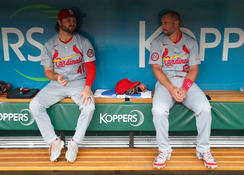 Jul 22, 2024; Pittsburgh, Pennsylvania, USA;  St. Louis Cardinals right fielder Alec Burleson (left) and first baseman Paul Goldschmidt (right) talk in the dugout before playing the Pittsburgh Pirates at PNC Park. Mandatory Credit: Charles LeClaire-USA TODAY Sports