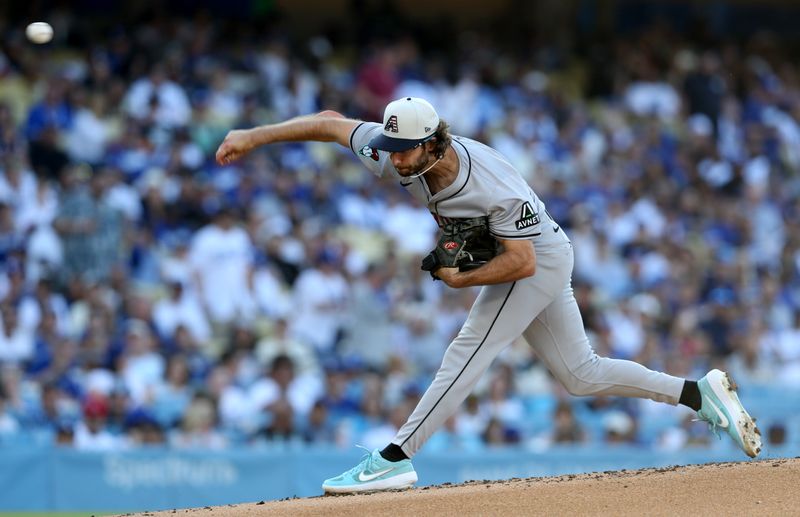 Jul 4, 2024; Los Angeles, California, USA; Arizona Diamondbacks pitcher Zac Gallen (23) throws during the first inning against the Los Angeles Dodgers at Dodger Stadium. Mandatory Credit: Jason Parkhurst-USA TODAY Sports