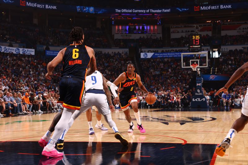 OKLAHOMA CITY, OK - APRIL 14: Jalen Williams #8 of the Oklahoma City Thunder dribbles the ball during the game against the Dallas Mavericks on April 14, 2024 at Paycom Arena in Oklahoma City, Oklahoma. NOTE TO USER: User expressly acknowledges and agrees that, by downloading and or using this photograph, User is consenting to the terms and conditions of the Getty Images License Agreement. Mandatory Copyright Notice: Copyright 2024 NBAE (Photo by Zach Beeker/NBAE via Getty Images)