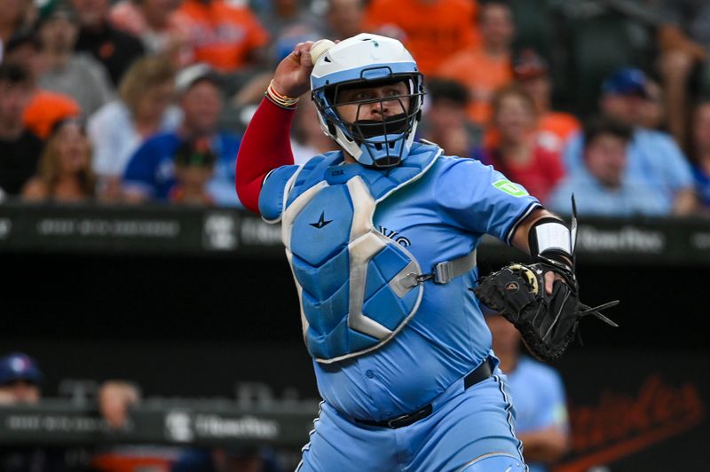 Jul 30, 2024; Baltimore, Maryland, USA; Toronto Blue Jays catcher Alejandro Kirk (30) throws to first base  to complete a third inning double play  against the Baltimore Orioles at Oriole Park at Camden Yards. Mandatory Credit: Tommy Gilligan-USA TODAY Sports