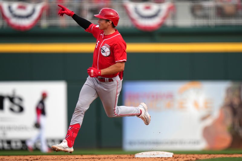 Feb. 24, 2024; Goodyear, Arizona, USA; Cincinnati Reds infielder Tyler Callihan hits a two-run home run in the eighth inning during a MLB spring training baseball game against the Cleveland Guardians at Goodyear Ballpark. Mandatory Credit: Kareem Elgazzar-USA TODAY Sports