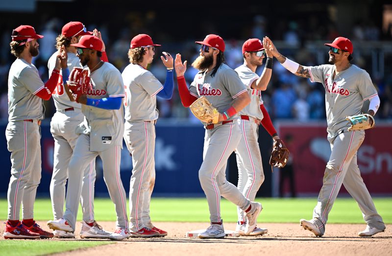 Apr 28, 2024; San Diego, California, USA; Philadelphia Phillies players celebrate on the field after defeating the San Diego Padres at Petco Park. Mandatory Credit: Orlando Ramirez-USA TODAY Sports