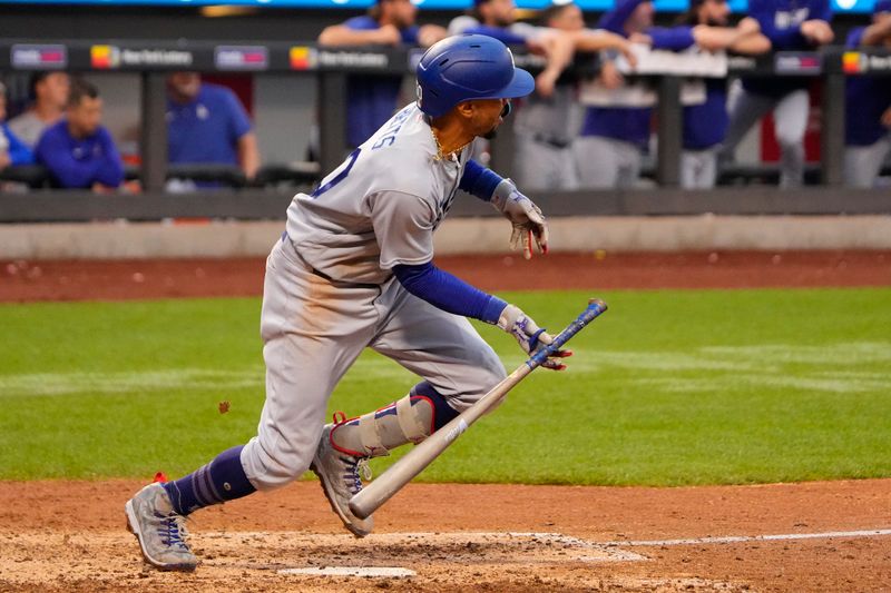 Jul 16, 2023; New York City, New York, USA; Los Angeles Dodgers second baseman Mookie Betts (50) runs out an RBI single against the New York Mets during the eighth inning at Citi Field. Mandatory Credit: Gregory Fisher-USA TODAY Sports