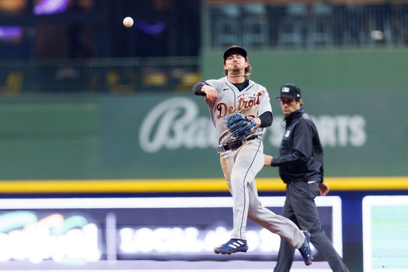 Apr 24, 2023; Milwaukee, Wisconsin, USA;  Detroit Tigers second baseman Zach McKinstry (39) throws to first base during the seventh inning against the Milwaukee Brewers at American Family Field. Mandatory Credit: Jeff Hanisch-USA TODAY Sports