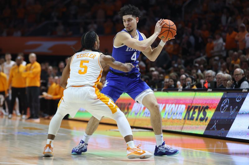 Jan 28, 2025; Knoxville, Tennessee, USA; Kentucky Wildcats guard Koby Brea (4) looks to move the ball against Tennessee Volunteers guard Zakai Zeigler (5) during the second half at Thompson-Boling Arena at Food City Center. Mandatory Credit: Randy Sartin-Imagn Images