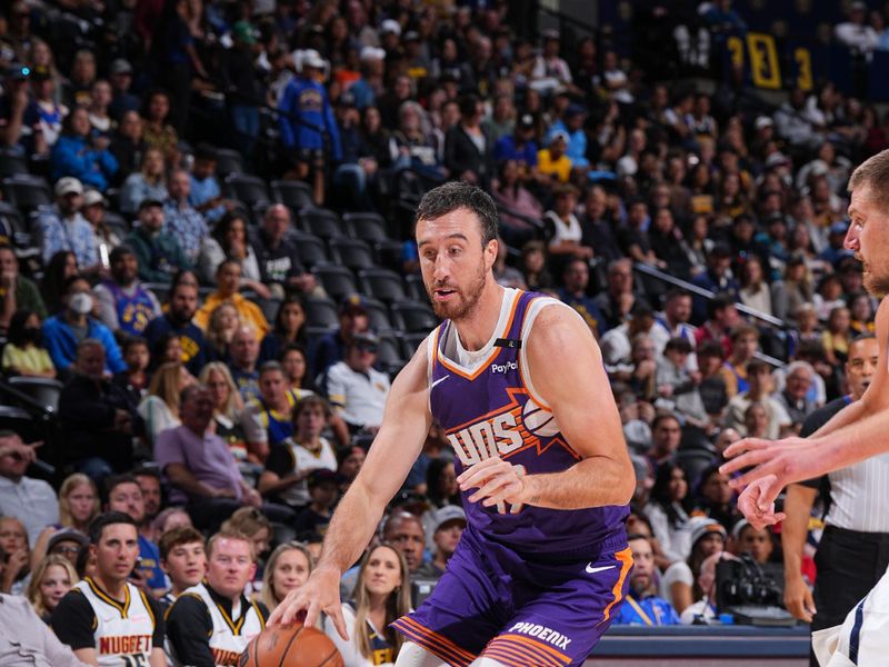 DENVER, CO - OCTOBER 13: Moses Wood #17 of the Phoenix Suns drives to the basket during the game against the Denver Nuggets on October 13, 2024 at Ball Arena in Denver, Colorado. NOTE TO USER: User expressly acknowledges and agrees that, by downloading and/or using this Photograph, user is consenting to the terms and conditions of the Getty Images License Agreement. Mandatory Copyright Notice: Copyright 2024 NBAE (Photo by Garrett Ellwood/NBAE via Getty Images)