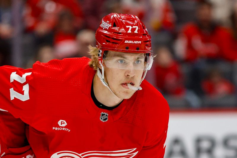 Mar 19, 2024; Detroit, Michigan, USA; Detroit Red Wings defenseman Simon Edvinsson (77) looks on during the first period at Little Caesars Arena. Mandatory Credit: Brian Bradshaw Sevald-USA TODAY Sports