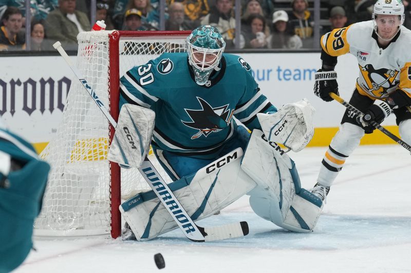 Nov 4, 2023; San Jose, California, USA; San Jose Sharks goaltender Magnus Chrona (30) watches the puck against the Pittsburgh Penguins during the third period at SAP Center at San Jose. Mandatory Credit: Darren Yamashita-USA TODAY Sports