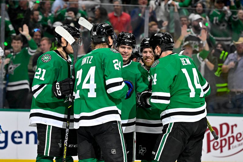 May 9, 2024; Dallas, Texas, USA; Dallas Stars left wing Jason Robertson (21) and center Roope Hintz (24) and defenseman Miro Heiskanen (4) and center Joe Pavelski (16) and left wing Jamie Benn (14) celebrates a power play goal scored by Heiskanen against the Colorado Avalanche during the second period in game two of the second round of the 2024 Stanley Cup Playoffs at American Airlines Center. Mandatory Credit: Jerome Miron-USA TODAY Sports