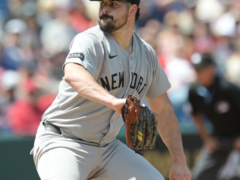 Apr 23, 2025; Cleveland, Ohio, USA; New York Yankees starting pitcher Carlos Rodon (55) throws a pitch during the first inning against the Cleveland Guardians at Progressive Field. Mandatory Credit: Ken Blaze-Imagn Images