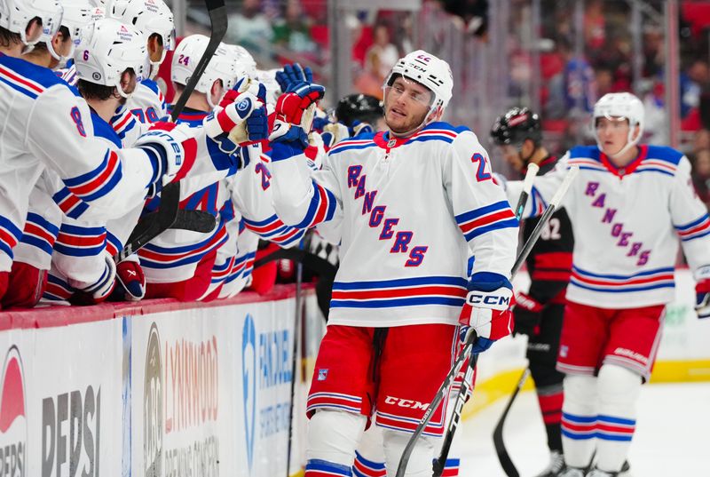 Nov 27, 2024; Raleigh, North Carolina, USA;  New York Rangers center Jonny Brodzinski (22) celebrates his goal against the Carolina Hurricanes during the first period at Lenovo Center. Mandatory Credit: James Guillory-Imagn Images