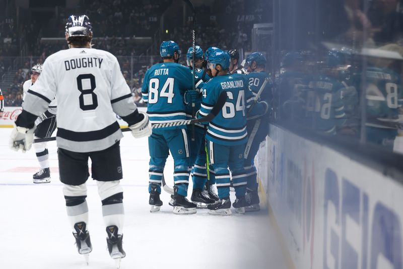 Dec 27, 2023; Los Angeles, California, USA; The San Jose Sharks celebrate a goal by San Jose Sharks left wing Fabian Zetterlund (20) against the Los Angeles Kings during the first period of a game at Crypto.com Arena. Mandatory Credit: Jessica Alcheh-USA TODAY Sports