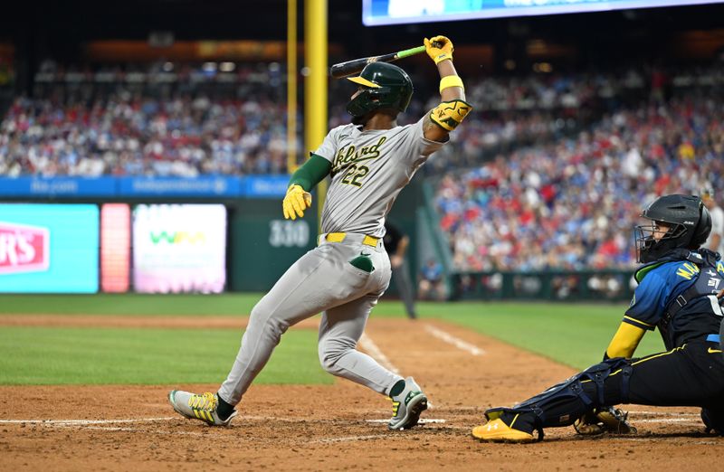 Jul 12, 2024; Philadelphia, Pennsylvania, USA; Oakland Athletics outfielder Miguel Andujar (22) hits an RBI single against the Philadelphia Phillies in the third inning at Citizens Bank Park. Mandatory Credit: Kyle Ross-USA TODAY Sports