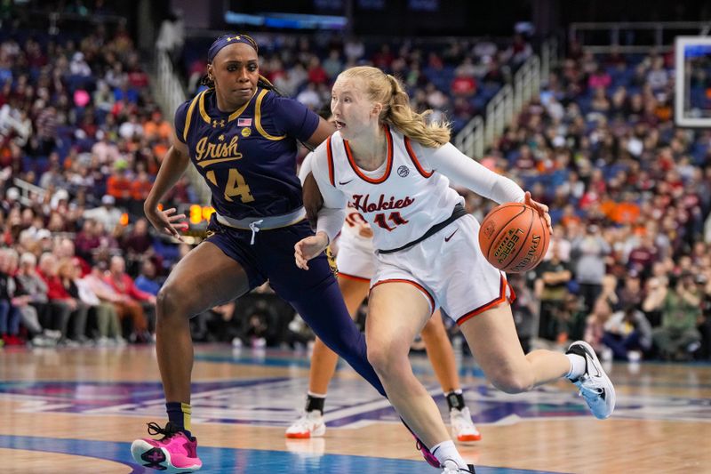 Mar 9, 2024; Greensboro, NC, USA; Virginia Tech Hokies guard Matilda Ekh (11) drives around Notre Dame Fighting Irish guard KK Bransford (14) in the first half at Greensboro Coliseum. Mandatory Credit: David Yeazell-USA TODAY Sports