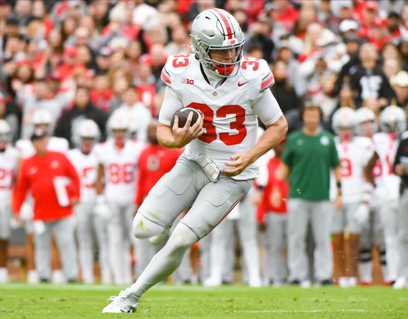 Oct 14, 2023; West Lafayette, Indiana, USA; Ohio State Buckeyes quarterback Devin Brown (33) runs for a touchdown during the first half at Ross-Ade Stadium. Mandatory Credit: Robert Goddin-USA TODAY Sports