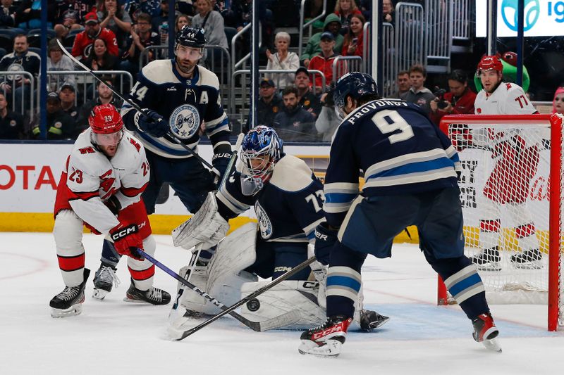 Apr 16, 2024; Columbus, Ohio, USA; Columbus Blue Jackets goalie Jet Greaves (73) makes a save as Carolina Hurricanes right wing Stefan Noesen (23) looks for a rebound during the third period at Nationwide Arena. Mandatory Credit: Russell LaBounty-USA TODAY Sports