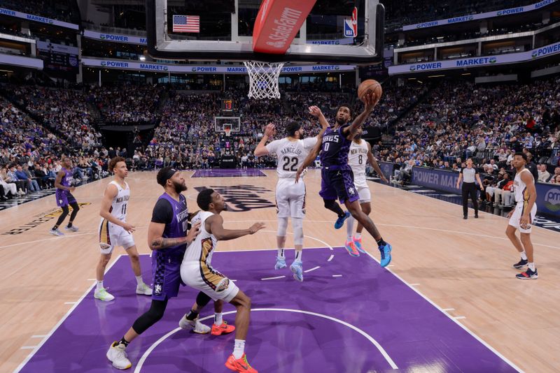 SACRAMENTO, CA - JANUARY 7:  Malik Monk #0 of the Sacramento Kings goes to the basket during the game on January 7, 2024 at Golden 1 Center in Sacramento, California. NOTE TO USER: User expressly acknowledges and agrees that, by downloading and or using this Photograph, user is consenting to the terms and conditions of the Getty Images License Agreement. Mandatory Copyright Notice: Copyright 2024 NBAE (Photo by Rocky Widner/NBAE via Getty Images)