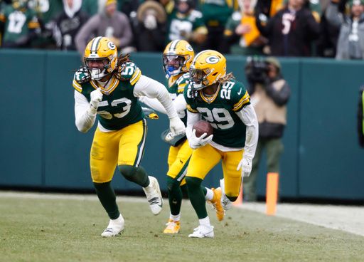 Green Bay Packers safety Xavier McKinney (29) runs back an interception during an NFL football game against the Chicago Bears Sunday, Jan. 5, 2025, in Green Bay, Wis. (AP Photo/Jeffrey Phelps