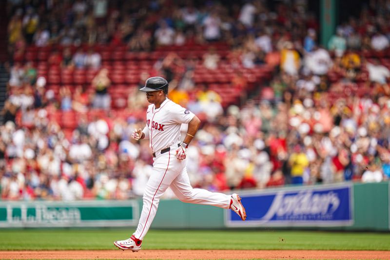 Jun 30, 2024; Boston, Massachusetts, USA; Boston Red Sox third baseman Rafael Devers (11) hits a two run home run against the San Diego Padres in the first inning at Fenway Park. Mandatory Credit: David Butler II-USA TODAY Sports
