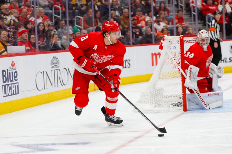 Dec 31, 2023; Detroit, Michigan, USA; Detroit Red Wings defenseman Ben Chiarot (8) handles the puck during the third period of the game against the Boston Bruins at Little Caesars Arena. Mandatory Credit: Brian Bradshaw Sevald-USA TODAY Sports