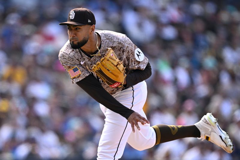 Apr 21, 2024; San Diego, California, USA; San Diego Padres relief pitcher Robert Suarez (75) throws a pitch against the Toronto Blue Jays during the ninth inning at Petco Park. Mandatory Credit: Orlando Ramirez-USA TODAY Sports
