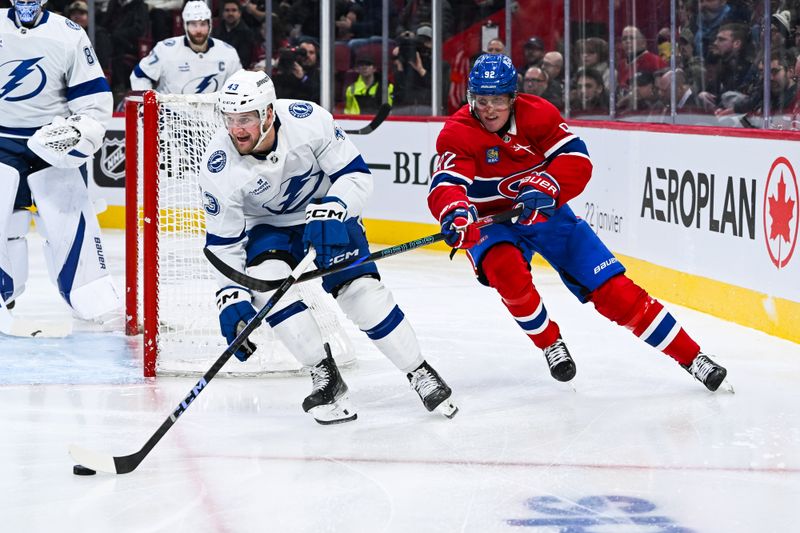 Jan 21, 2025; Montreal, Quebec, CAN; Tampa Bay Lightning defenseman Darren Raddysh (43) defends the puck against Montreal Canadiens right wing Patrik Laine (92) during the third period at Bell Centre. Mandatory Credit: David Kirouac-Imagn Images