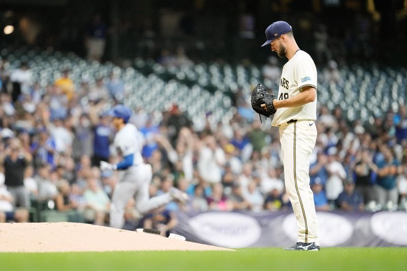 Aug 13, 2024; Milwaukee, Wisconsin, USA;  Milwaukee Brewers pitcher Colin Rea (48) looks on after giving up a home run to Los Angeles Dodgers designated hitter Shohei Ohtani (17) during the third inning at American Family Field. Mandatory Credit: Jeff Hanisch-USA TODAY Sports