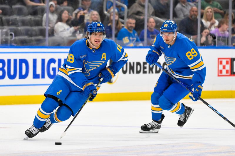 Oct 2, 2025; St. Louis, Missouri, USA; St. Louis Blues center Robert Thomas (18) controls the puck against the Ottawa Senators during the second period at Enterprise Center. Mandatory Credit: Jeff Curry-Imagn Images