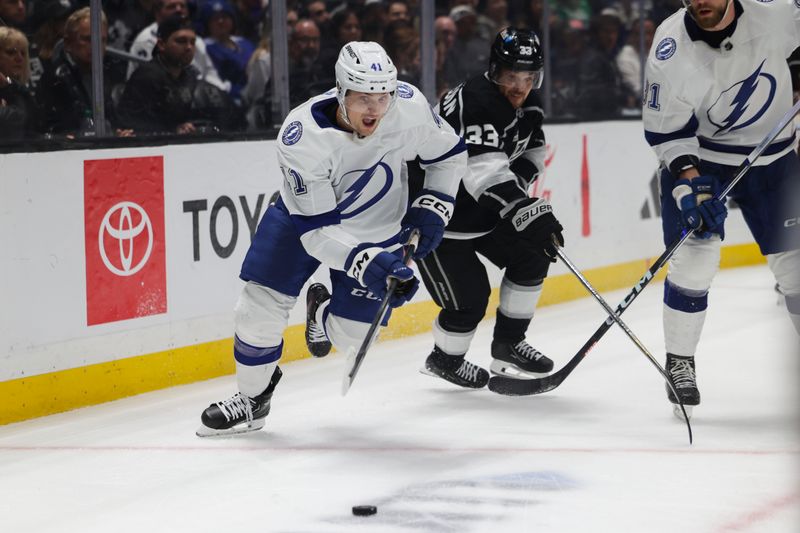 Mar 23, 2024; Los Angeles, California, USA; Tampa Bay Lighting right wing Mitchell Chaffee (41) and Los Angeles Kings goalie Cam Talbot (33) chase the puck during the second period of an NHL hockey game at Crypto.com Arena. Mandatory Credit: Yannick Peterhans-USA TODAY Sports