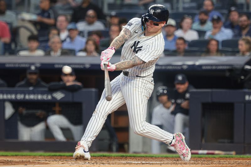 May 21, 2024; Bronx, New York, USA; New York Yankees left fielder Alex Verdugo (24) doubles during the fourth inning against the Seattle Mariners at Yankee Stadium. Mandatory Credit: Vincent Carchietta-USA TODAY Sports