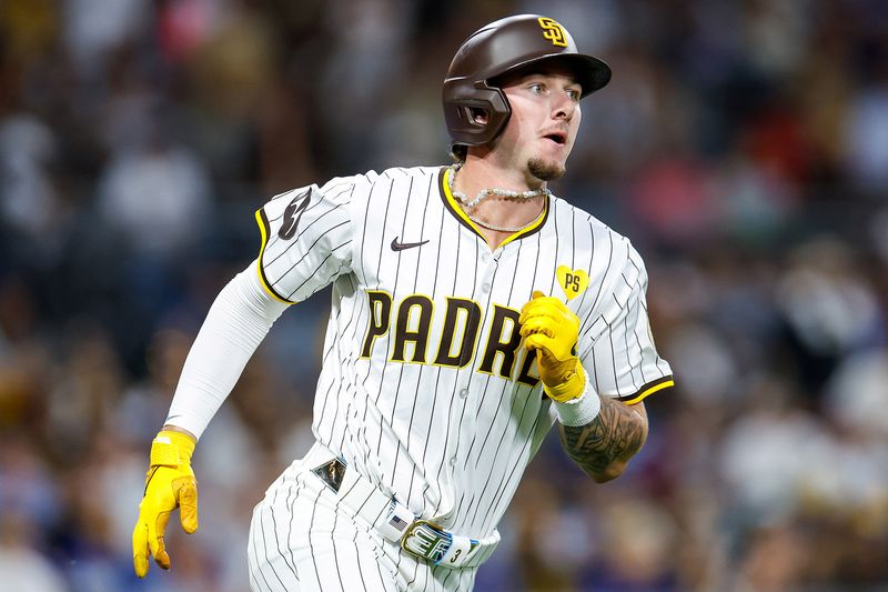 Jul 31, 2024; San Diego, California, USA; San Diego Padres center fielder Jackson Merrill (3) runs after hitting a RBI double during the seventh inning against the Los Angeles Dodgers at Petco Park. Mandatory Credit: David Frerker-USA TODAY Sports