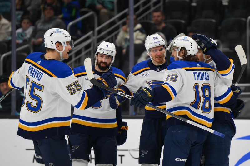 Jan 26, 2024; Seattle, Washington, USA; The St. Louis Blues celebrate after center Robert Thomas (18) scored a goal against the Seattle Kraken during the third period at Climate Pledge Arena. Mandatory Credit: Steven Bisig-USA TODAY Sports