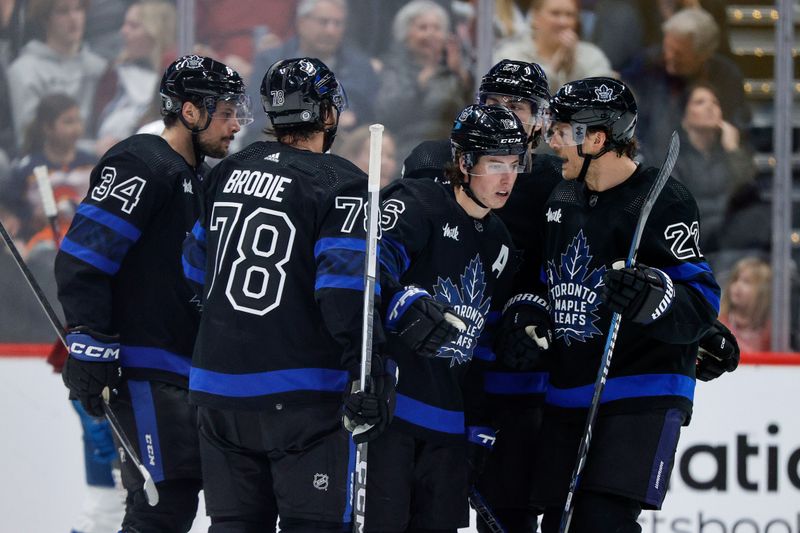 Feb 24, 2024; Denver, Colorado, USA; Toronto Maple Leafs right wing Mitchell Marner (16) reacts with defenseman TJ Brodie (78) and center Auston Matthews (34) and left wing Matthew Knies (23) and defenseman Jake McCabe (22) after his goal in the second period against the Colorado Avalanche at Ball Arena. Mandatory Credit: Isaiah J. Downing-USA TODAY Sports