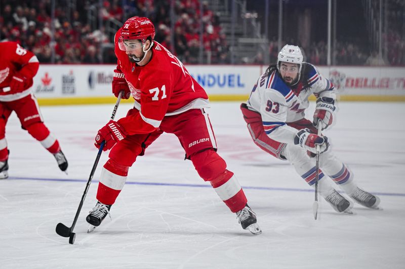 Apr 5, 2024; Detroit, Michigan, USA; Detroit Red Wings center Dylan Larkin (71) brings the puck up ice against New York Rangers center Mika Zibanejad (93) during the second period at Little Caesars Arena. Mandatory Credit: Tim Fuller-USA TODAY Sports