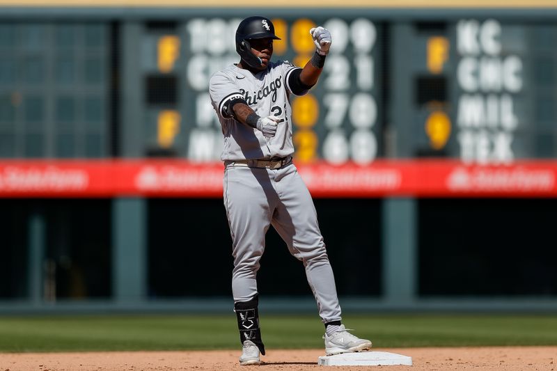 Aug 20, 2023; Denver, Colorado, USA; Chicago White Sox right fielder Oscar Colas (22) reacts from second on a two RBI double in the eighth inning against the Colorado Rockies at Coors Field. Mandatory Credit: Isaiah J. Downing-USA TODAY Sports