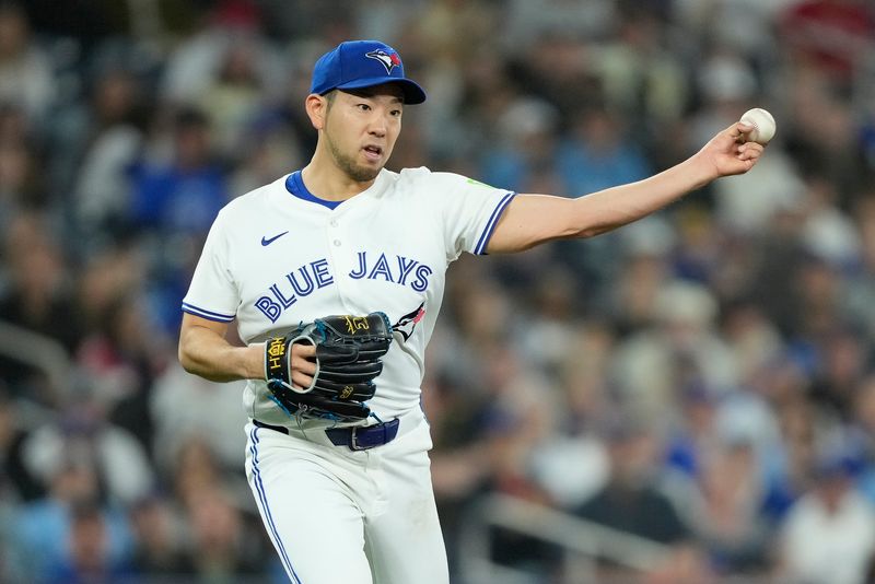 Apr 16, 2024; Toronto, Ontario, CAN; Toronto Blue Jays starting pitcher Yusei Kikuchi (16) throws out New York Yankees third baseman Oswaldo Cabrera (not pictured) at first base on a ground ball during the second inning at Rogers Centre. Mandatory Credit: John E. Sokolowski-USA TODAY Sports