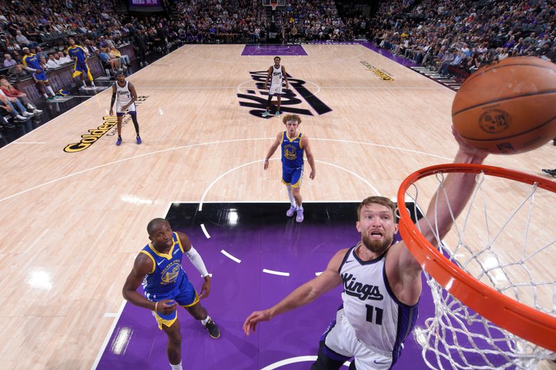 SACRAMENTO, CA - OCTOBER 9: Domantas Sabonis #11 of the Sacramento Kings dunks the ball during the game against the Golden State Warriors during a NBA preseason game on October 9, 2024 at Golden 1 Center in Sacramento, California. NOTE TO USER: User expressly acknowledges and agrees that, by downloading and or using this Photograph, user is consenting to the terms and conditions of the Getty Images License Agreement. Mandatory Copyright Notice: Copyright 2024 NBAE (Photo by Rocky Widner/NBAE via Getty Images)
