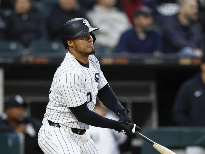 Apr 30, 2025; Chicago, Illinois, USA; Chicago White Sox second baseman Lenyn Sosa (50) hits an RBI single against the Milwaukee Brewers during the second inning at Rate Field. Mandatory Credit: Kamil Krzaczynski-Imagn Images