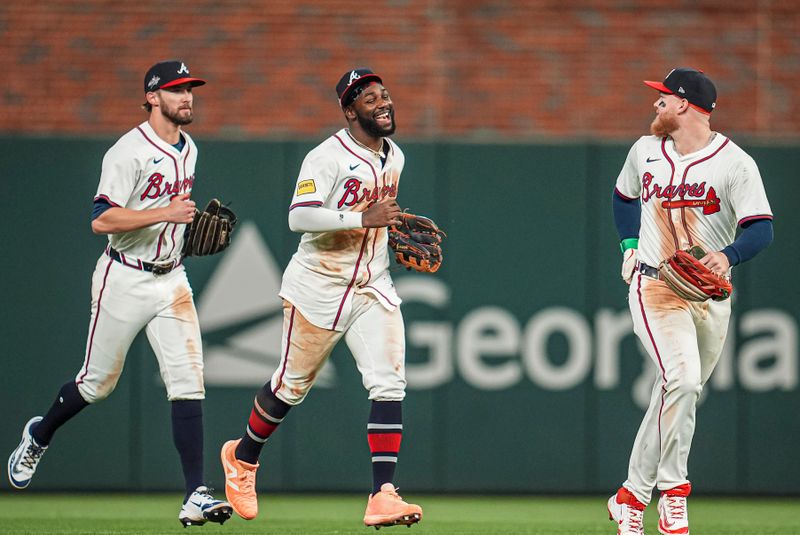 May 13, 2025; Cumberland, Georgia, USA; Atlanta Braves outfielders Eli White Michael Harris II and Alex Verdugo react after defeating the Washington Nationals at Truist Park. Mandatory Credit: Dale Zanine-Imagn Images