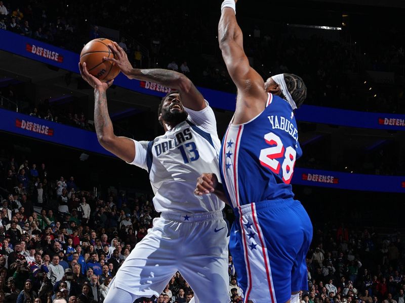 PHILADELPHIA, PA - FEBRUARY 4: Naji Marshall #13 of the Dallas Mavericks drives to the basket during the game against the Philadelphia 76ers on February 4, 2025 at the Wells Fargo Center in Philadelphia, Pennsylvania NOTE TO USER: User expressly acknowledges and agrees that, by downloading and/or using this Photograph, user is consenting to the terms and conditions of the Getty Images License Agreement. Mandatory Copyright Notice: Copyright 2025 NBAE (Photo by Jesse D. Garrabrant/NBAE via Getty Images)