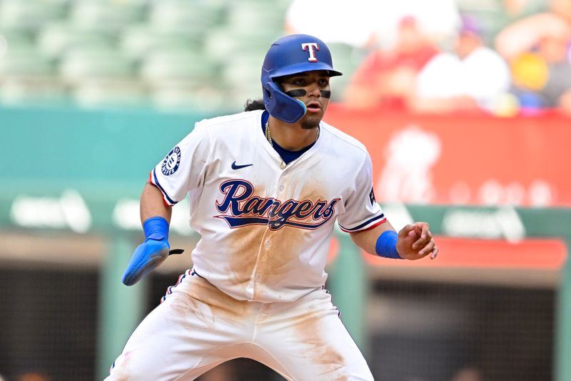 May 31, 2025; Arlington, Texas, USA; Texas Rangers left fielder Alejandro Osuna (19) leads off from first base during the seventh inning against the Texas Rangers at Globe Life Field. Mandatory Credit: Jerome Miron-Imagn Images