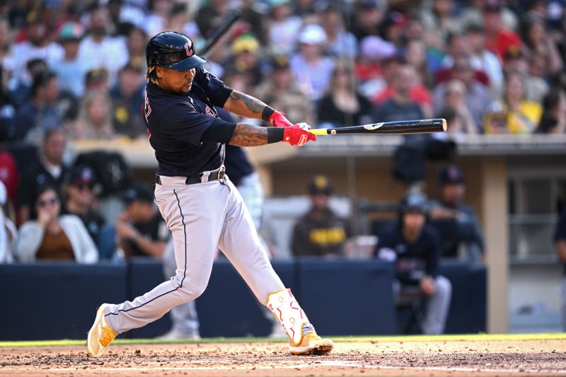 Jun 15, 2023; San Diego, California, USA; Cleveland Guardians third baseman Jose Ramirez (11) hits an RBI double against the San Diego Padres during the second inning at Petco Park. Mandatory Credit: Orlando Ramirez-USA TODAY Sports