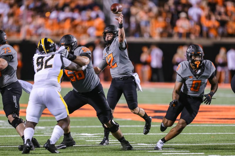 Sep 17, 2022; Stillwater, Oklahoma, USA; Oklahoma State Cowboys quarterback Gunnar Gundy (12) throws against the Arkansas-Pine Bluff Golden Lions during the third quarter at Boone Pickens Stadium. OSU won 63-7. Mandatory Credit: Nathan J. Fish-USA TODAY Sports