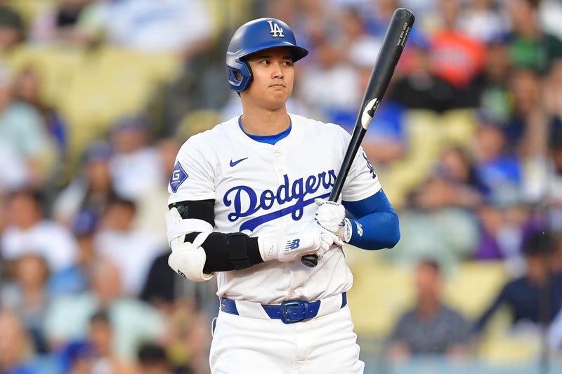 Jun 12, 2024; Los Angeles, California, USA; Los Angeles Dodgers designated hitter Shohei Ohtani (17) reacts during an at bat against the Texas Rangers during the first inning at Dodger Stadium. Mandatory Credit: Gary A. Vasquez-USA TODAY Sports